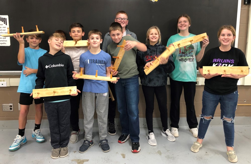 Seventh graders show off their coat racks
