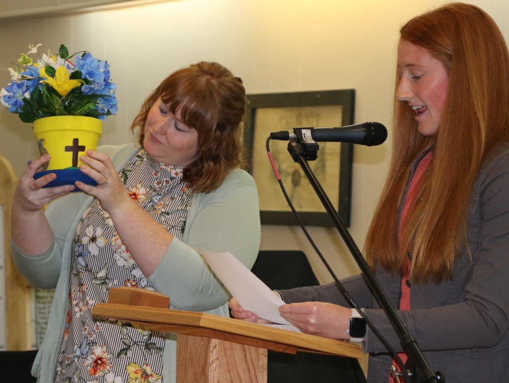 Brianna Stroble presents her Most Influential Educator Shelbi Blankenbaker with flowers