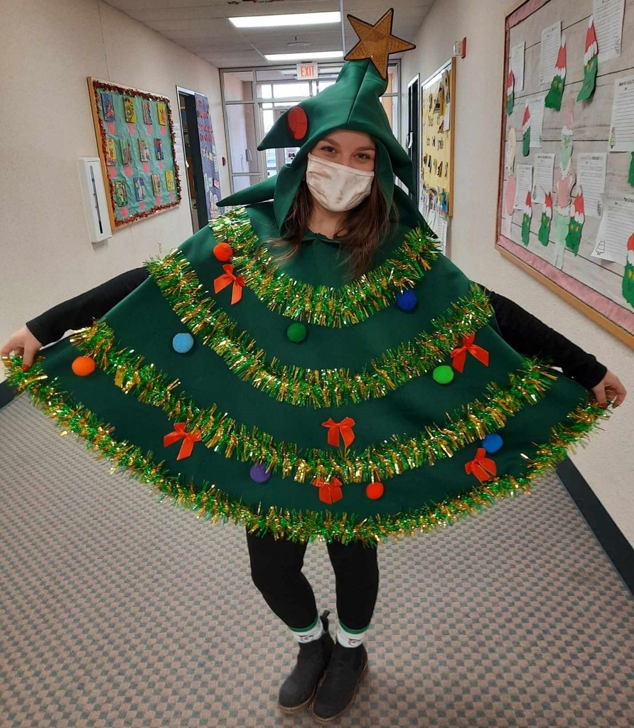 Woman dressed in a christmas tree skirt