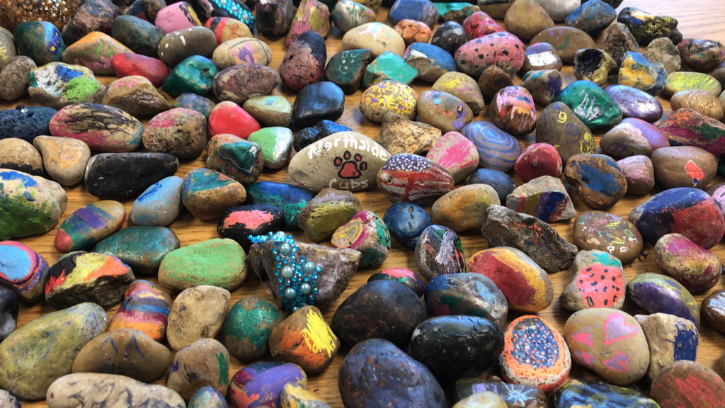 Lots of hand-decorated rocks
