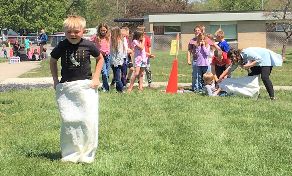 Northside students play sack race game