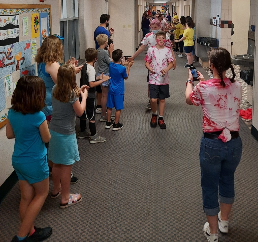6th grade parades down halls of MES