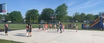 BIS students play on basketball court during field day