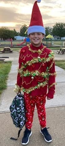 Boy dressed up like Christmas elf