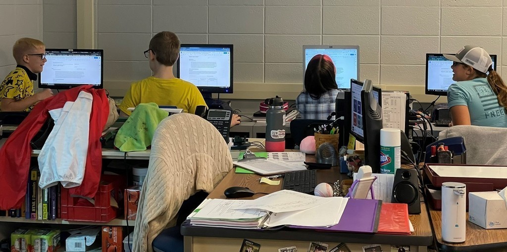 2 boys and 2 girls working on computers