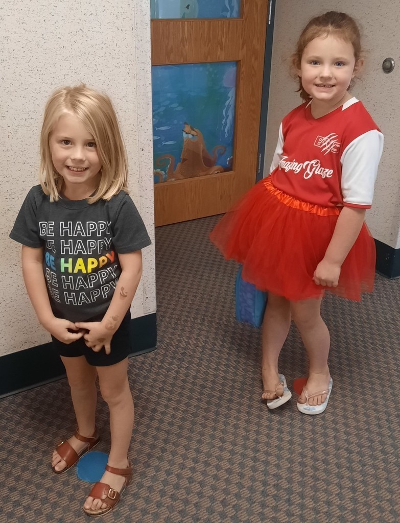 two little girls dressed in spirit gear