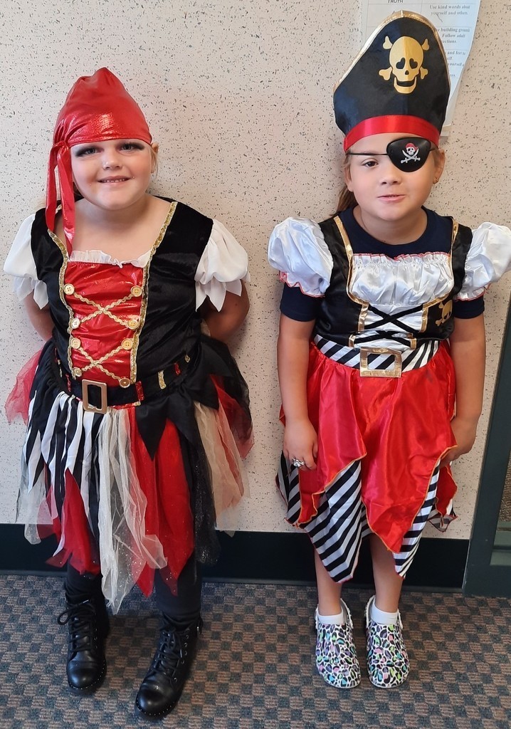 Two girls dressed like pirates