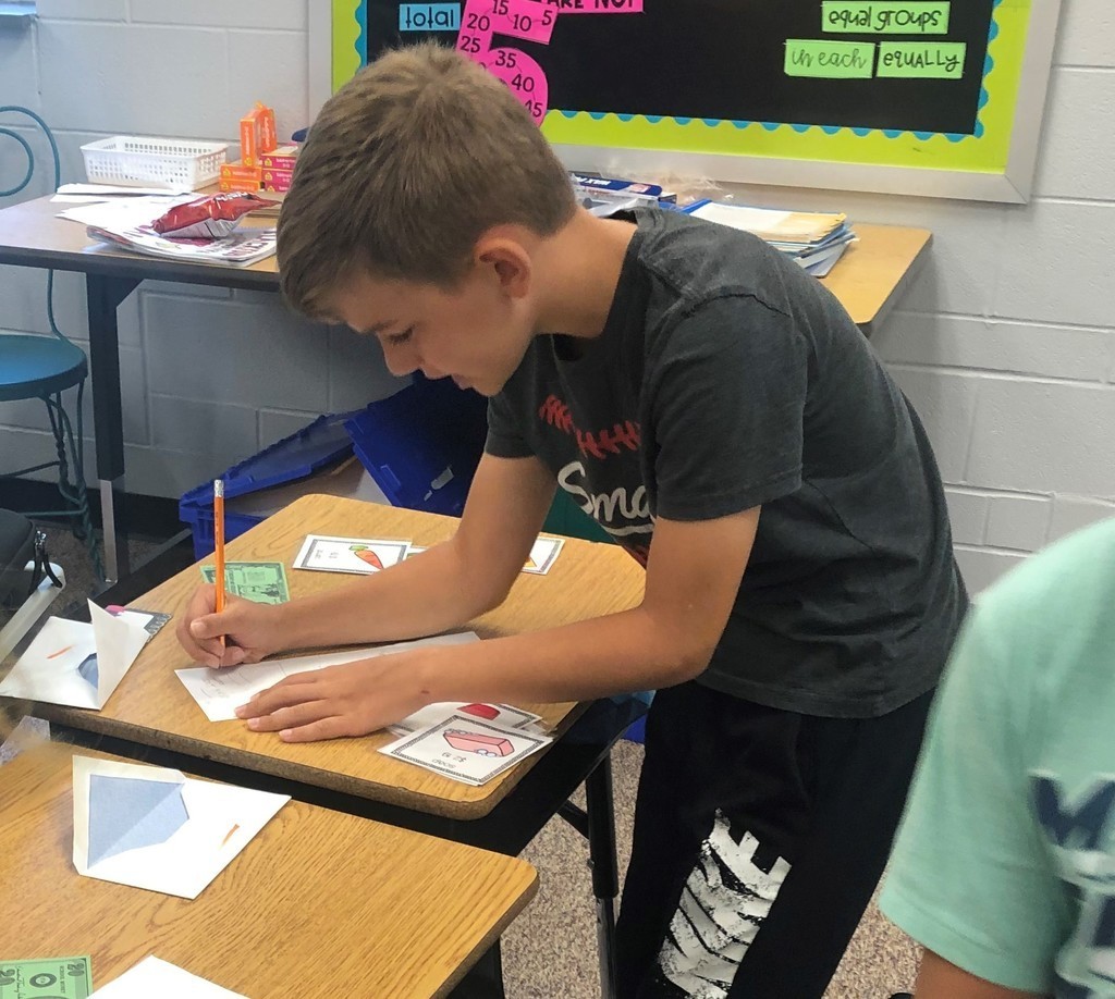 Student adding up a math problem