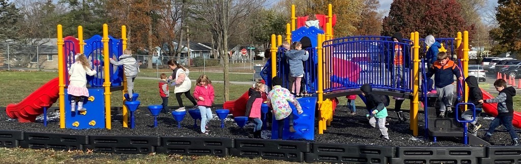 Kids playing on Northside playground equipment