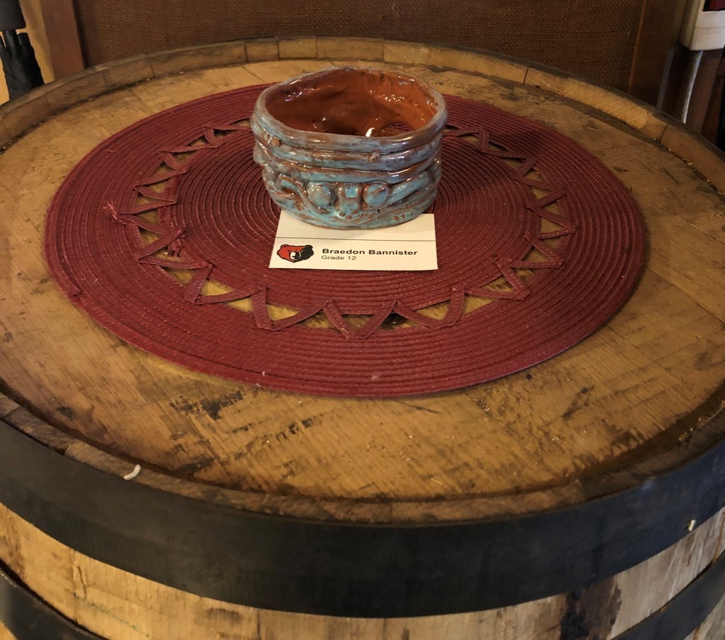 Pottery on a barrel by Brandon Bannister