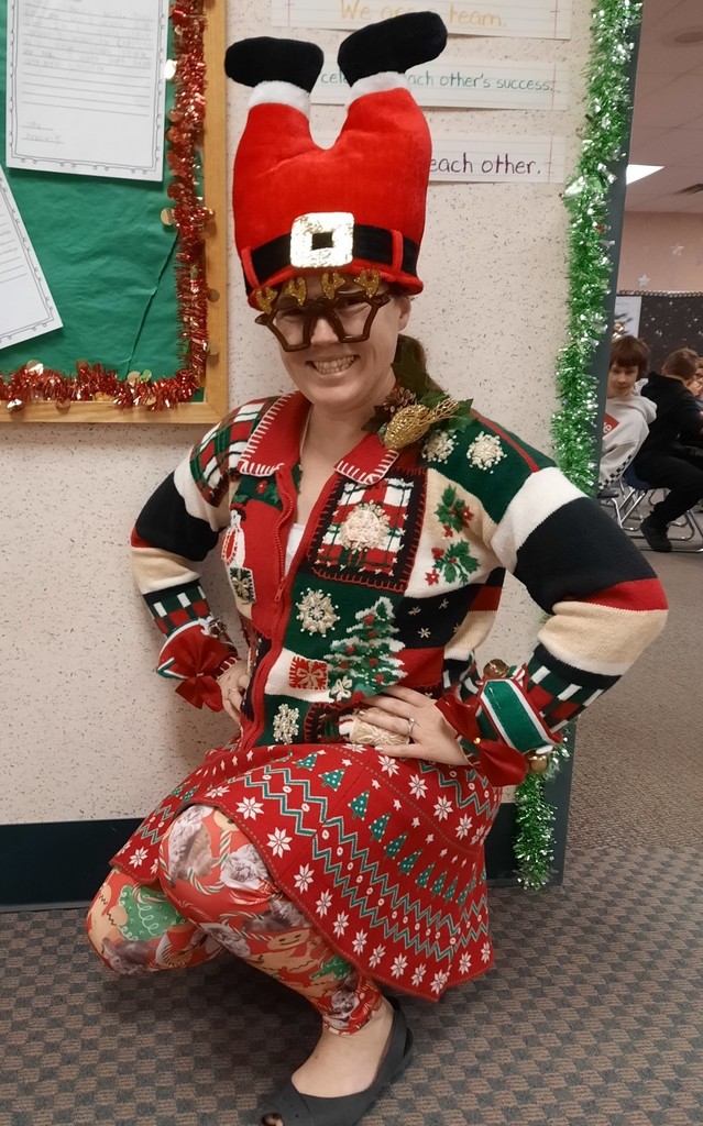 Staffer with Santa pants on her head