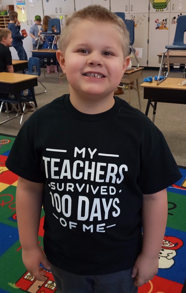 Boy wearing 100 Days t-shirt