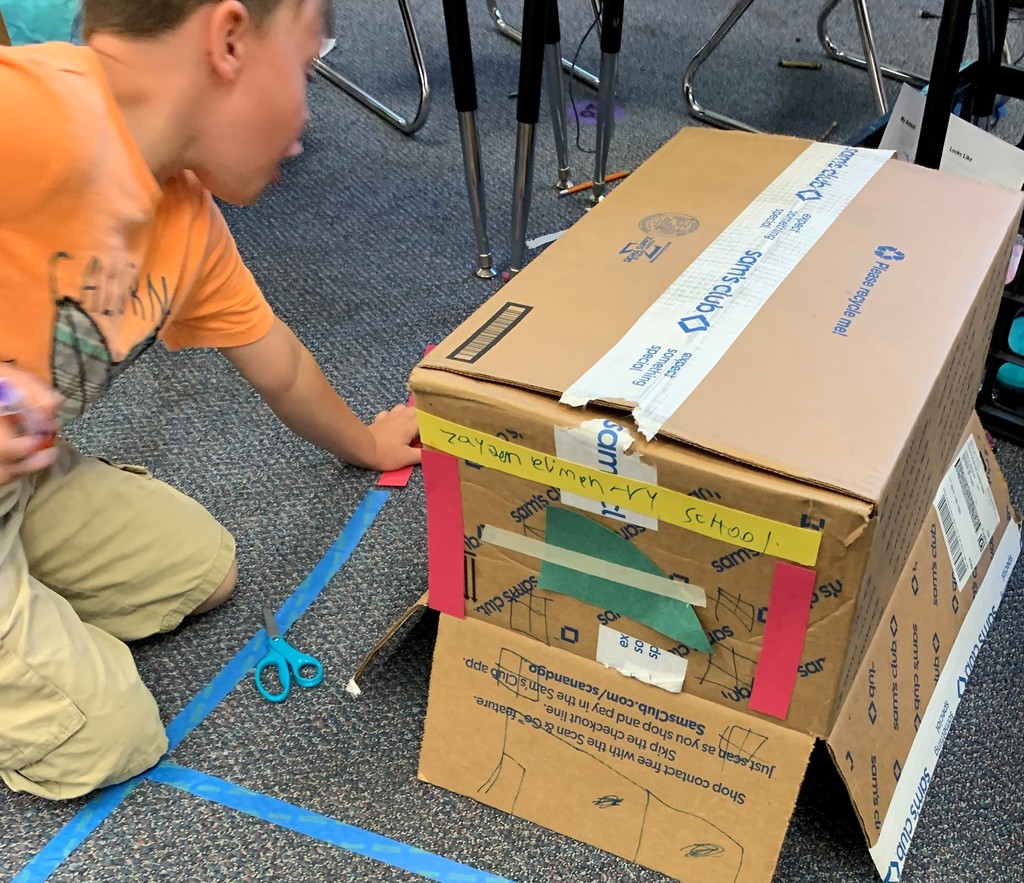 First grade student creates a school out of a box