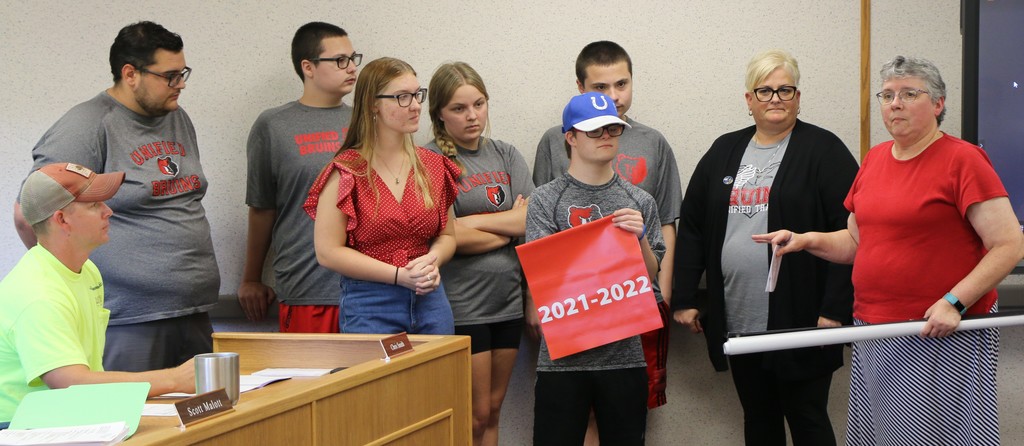 Unified sports participants and coaches share at board meeting