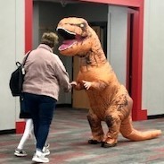 Dinosaur greets students