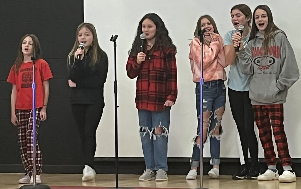 Students participate in karaoke during Jollyfest