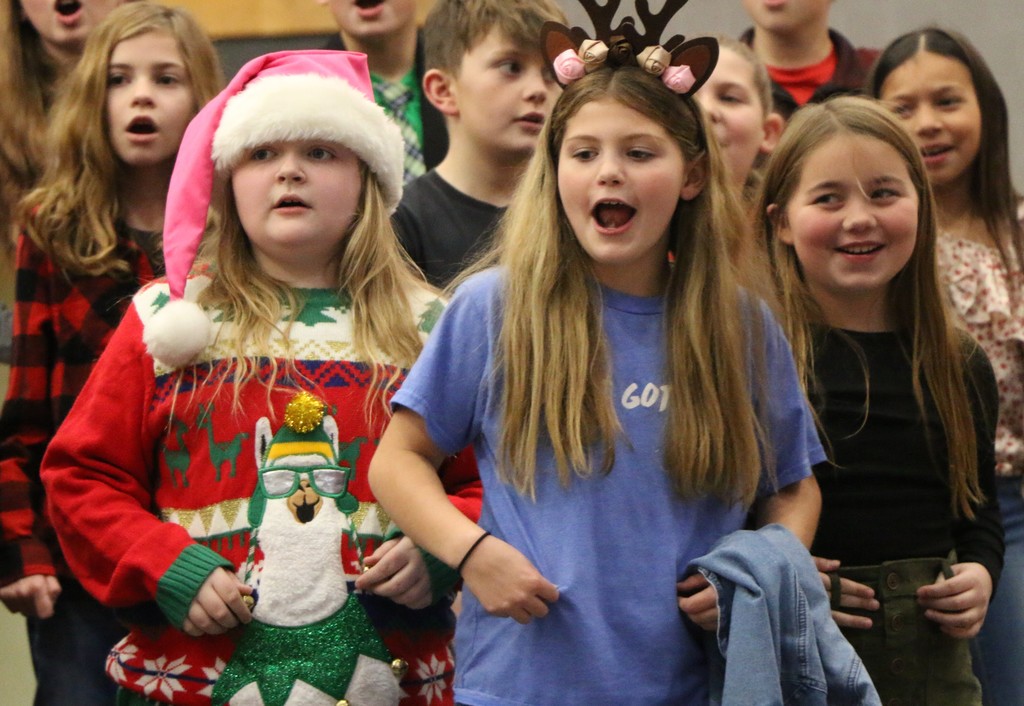 Students sign during Christmas program