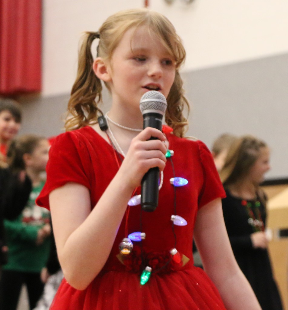 Girl sings during BIS Christmas program