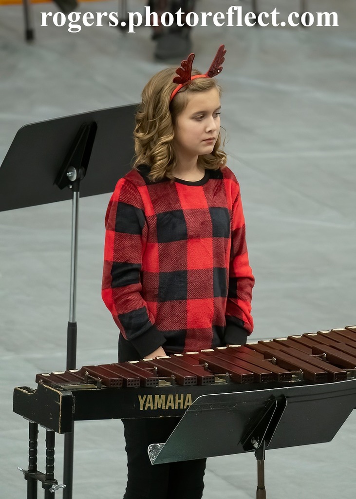 Girl plays xylophone during concert