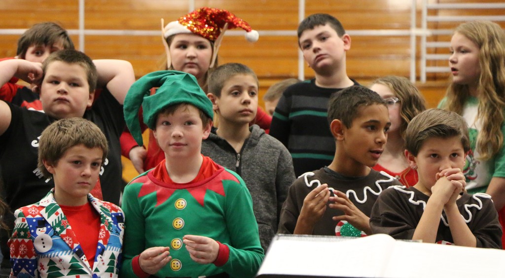 Students prepare to perform during the BIS Christmas program