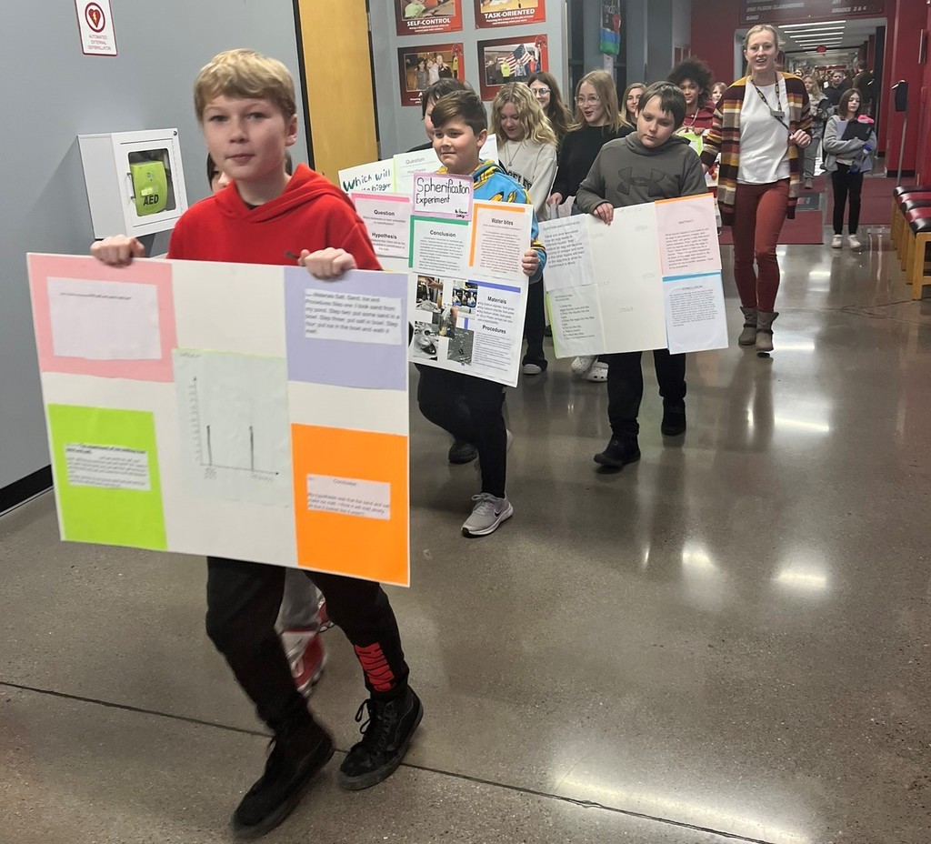 Students display their projects during the Science Fair Parade
