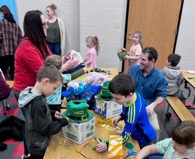 students and parents work on leprechaun traps