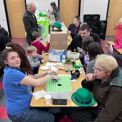 Students and their families make leprechaun traps at BPS