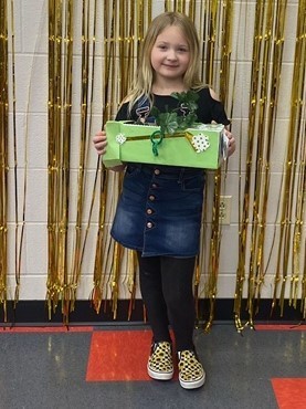 Little girl displays her leprechaun trap