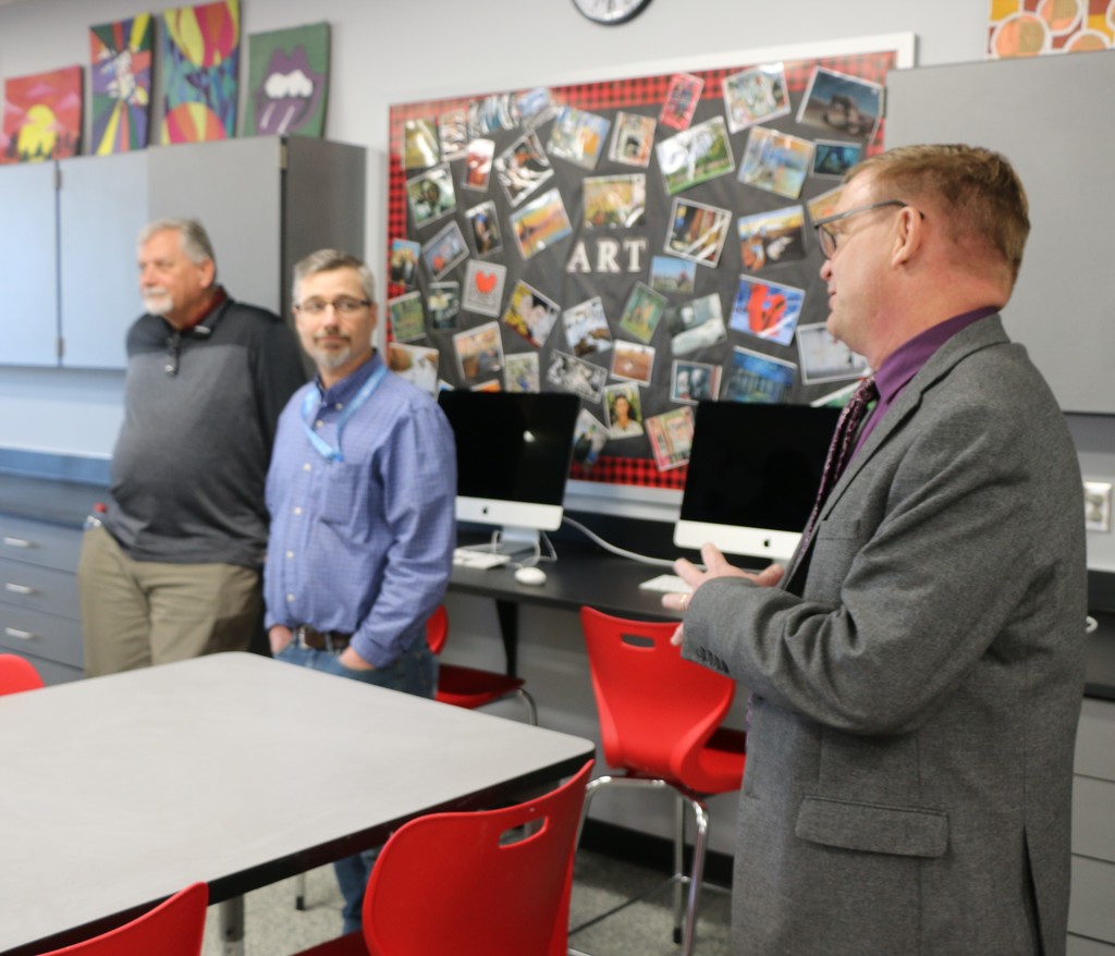 Chad Yencer takes school board members on a tour of the recently renovated art rooms