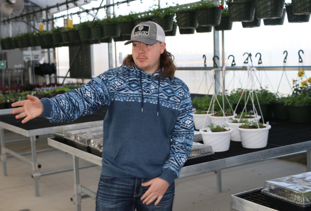 BJSHS student Colton Yoder was one of the guides through the new greenhouse tour