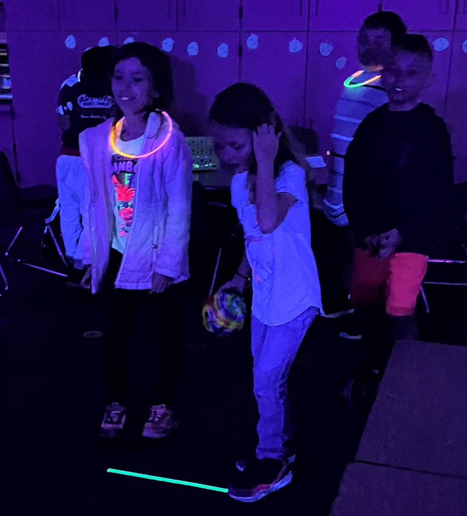 1st graders participate in glow party