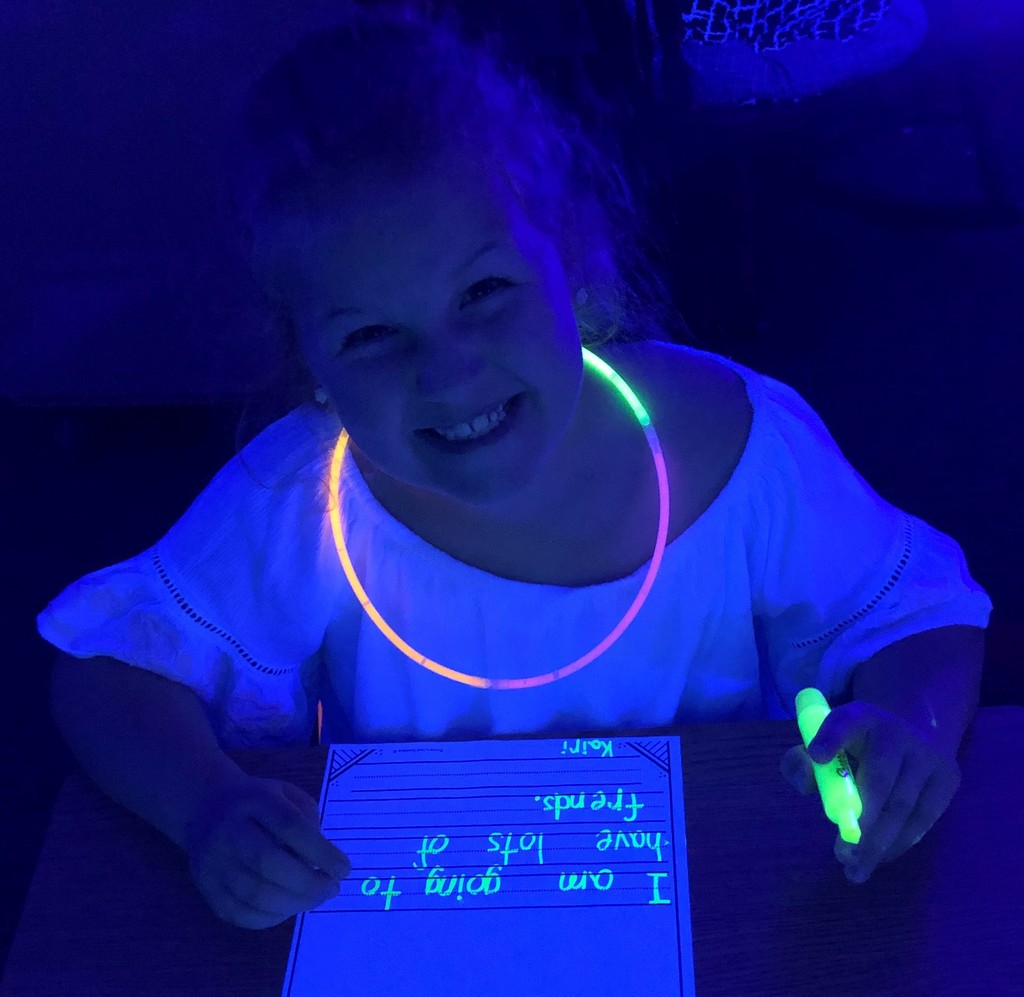1st grader participates in a Glow Party