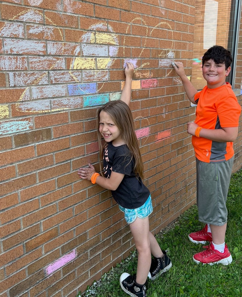 Two 3rd grade students decorate the BIS