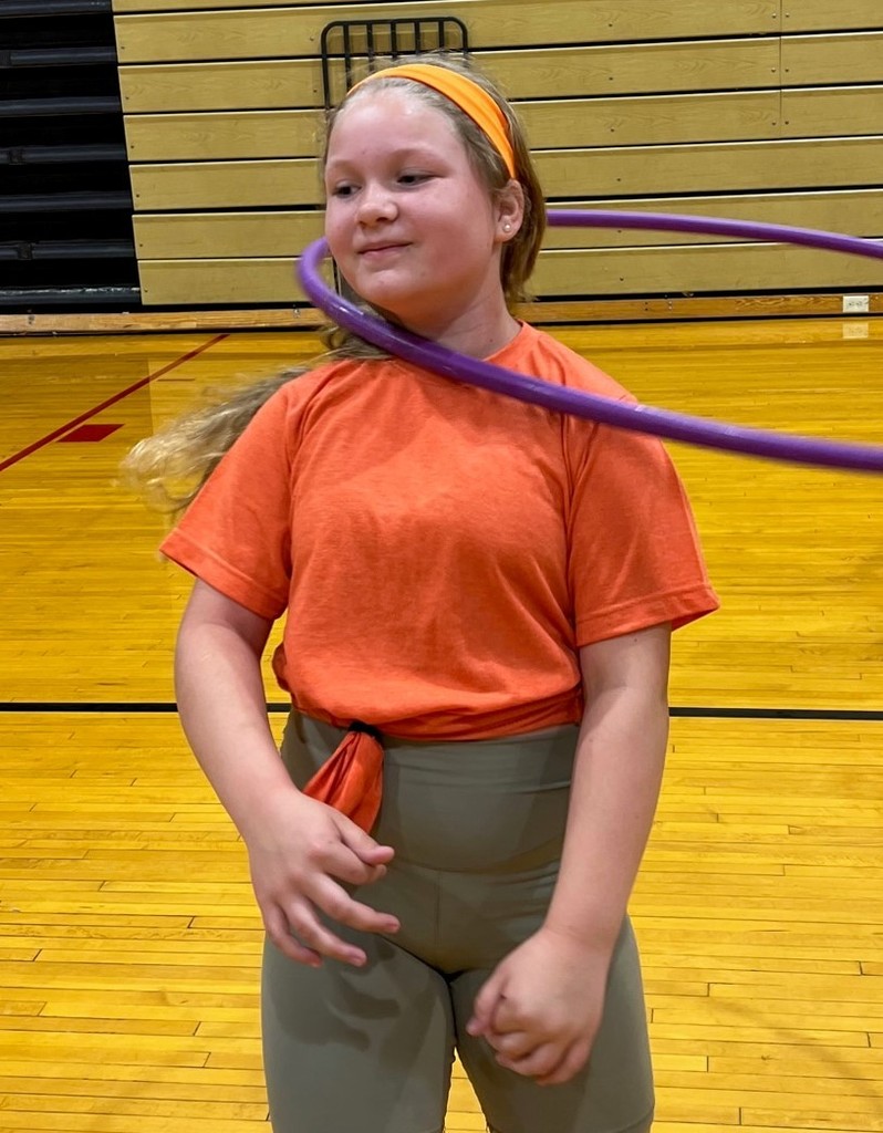 3rd grade girl practices her hula hoop skills