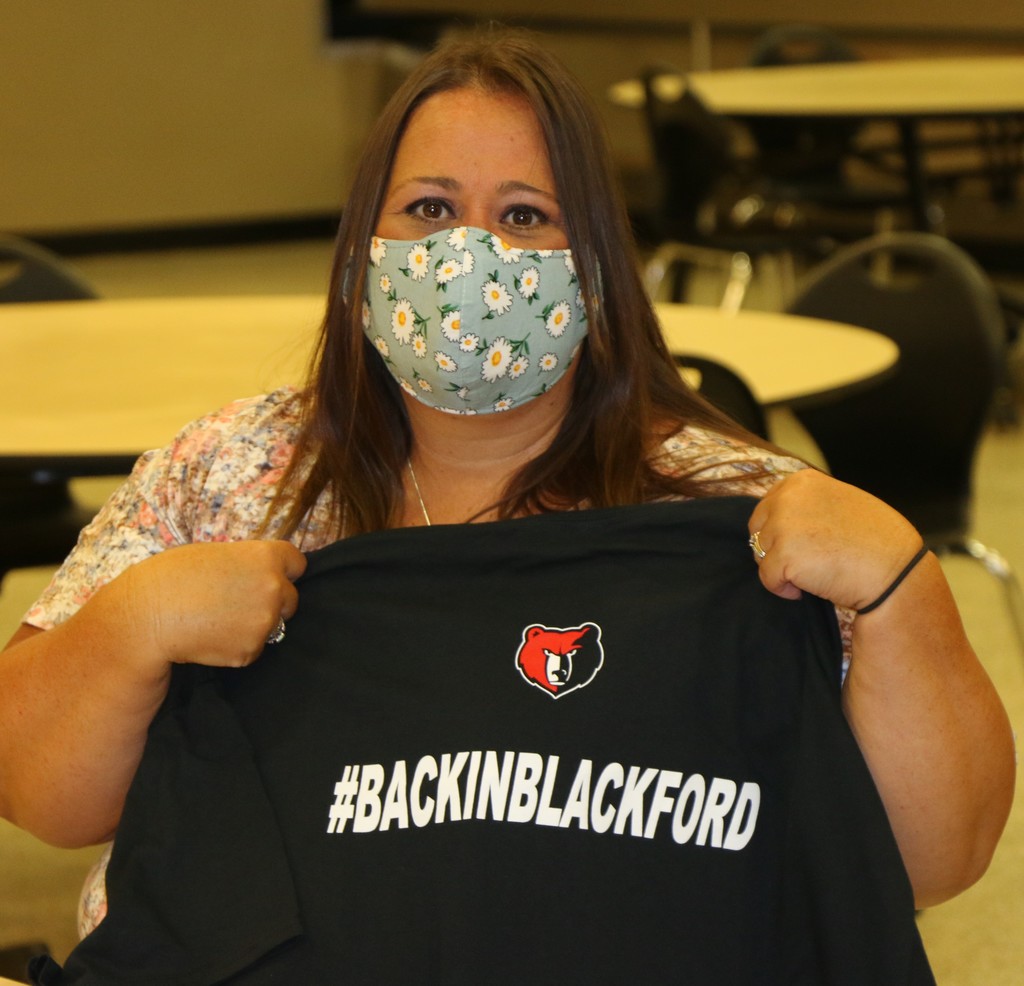 Denise Rogers holding #BackInBlackford shirt